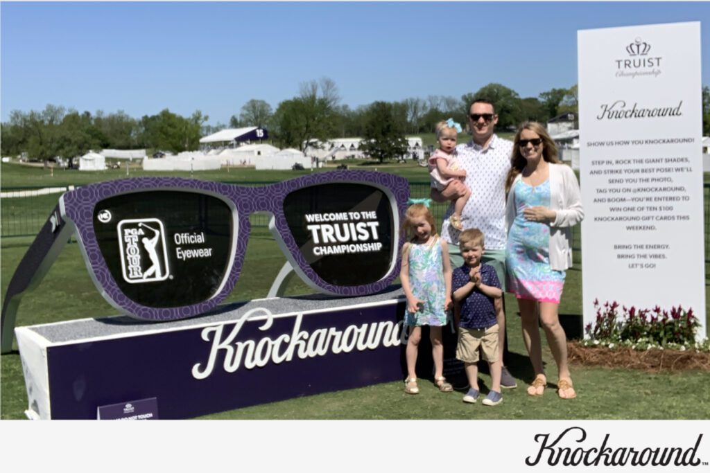 family posing in front of the sunglasses